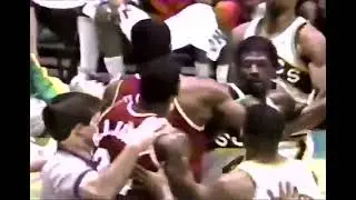 Houston&rsquo;s Hakeem Olajuwon punches Seattle&rsquo;s Michael Cage in the mouth. March 3, 1989
