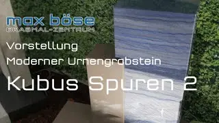 Moderner Urnengrabstein mit Fr&uuml;hlingsdeko - Modell Kubus Spuren 2 - max boese Grabmalzentrum