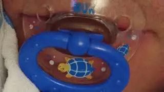 unique orthodontic pacifier with blue ring