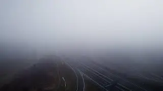Aerial view of mysterious highway with traffic in German forest landscape - TiMovie Stock Footage