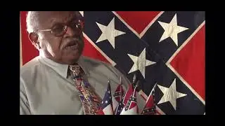 SCV member Nelson W. Winbush explains the Confederate Battle Flag.