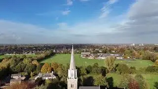 Scenic Aerial View of a Charming Small Town Surrounded by Greenery