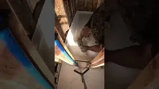 Installing  shower pan  base with quick set mortar.