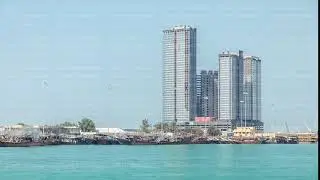 Traditional wooden fishing dhows berthed in the Dhow Harbour in Abu Dhabi timelapse