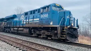 Conrail Heritage unit leads NS freight train, foreign BNSF power on NS, long CSX mixed freight