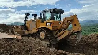 Pushing raw materials for stockpiling,,.