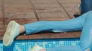 Wetlook 2 Girls need to cool their dry sneakers in pool because it is a hot day in summer