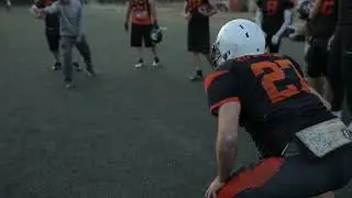 VideoVault Stock Video: American football players tackle each other for possession of the ball