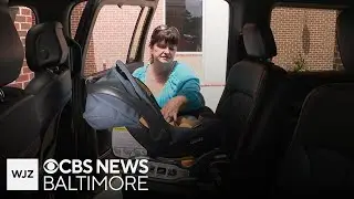 Maryland nurse demonstrates how to install child car seat