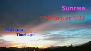 A mildly cloudy sunrise sends its colours across the whole sky, before leading to a lovely morning