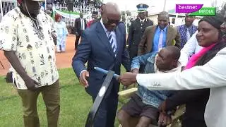 GOVERNOR  ONGWAE CARRIES A DISABLED MAN ON MASHUJAA DAY BY  BESTNET MEDIA