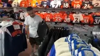 Sports apparel store near Empower Field ready for new season but curious about future