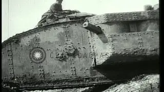 Mark I tank moves over a trench as soldiers sit on it during Battle of Arras in W...HD Stock Footage