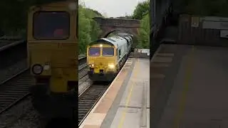 class 66 driver hits the throttle through Alfreton station Derbyshire England