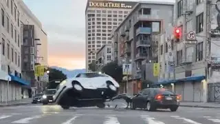 Vehicle tips over after getting hit on stream