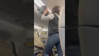 Airplane overhead bin drama