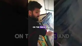 Watch a removalist lift a fridge