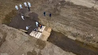Mass burial captured by drone in New York City as morgues pushed to limit