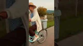 A rural idyll, a grandmother, a goat, and a little curiosity 🚲😂 #grandmaandgoat #viral #omg