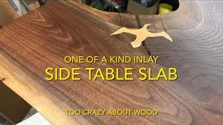 Walnut side table slab with maple inlay over a large check.