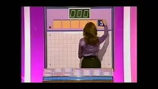 Carol Vorderman in Purple Satin Blouse
