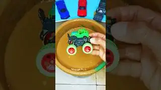 Satisfying ASMR video of a muddy green toy truck being cleaned slowly