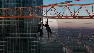 Extreme Climbers Hang From Moscow Crane for Illegal Stunt