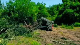 Clearing trees in our pasture with a skid steer