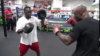 King Mo Lawal padwork with Jeff Mayweather inside Mayweather Boxing Club