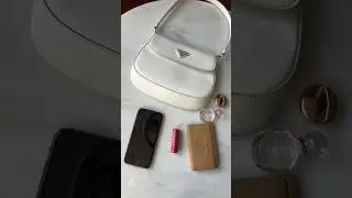 Prada Cleo flap mini in white looks mini but it sure fits a ton! #bagoftheday #whatsinmybag #minibag