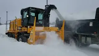 Larue T60 self-propelled snow blower loading a truck
