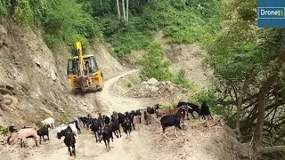 Hilly Narrow Damaged Dusty Road-Following JCB Backhoe Loader