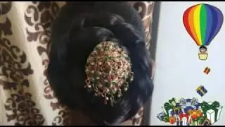 Stylish regular bun , easy & quick hair style,for religious function,made by satatra shobha fashion.