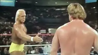 Roddy Piper and Hulk Hogan shake hands after tagging together in Dec 1986