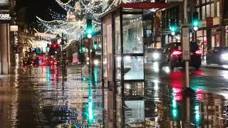 Downtown lights in the rain. 15 min rain with car ambient noise