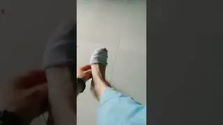 she took off shoe to show her white ped sock has slipped down