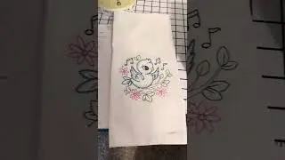 Embroidered tea towel songbird