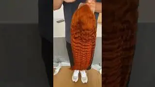 Orange deep wave wig.