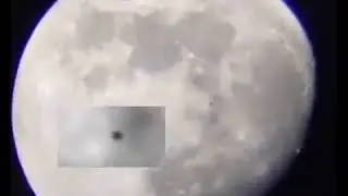 UFO flying past the moon