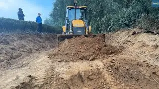 Mountain Road Track Resurfacing on Chill Foggy Day with JCB backhoe