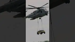 Helicopter drops off humvee