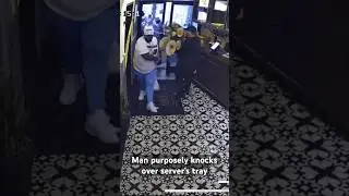 A man was caught on camera purposely knocking over a server&rsquo;s tray at a #Miami restaurant. #shorts
