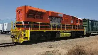 SJVR 2409 centerbeam train passing Clntion with the Broken Railroad Crossing Gate