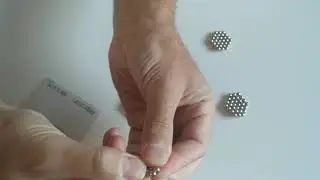 Magnetic balls antistress toy, press in the middle