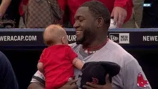 Big Papi holds young fan during national anthem