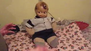 Kewpie Putting on the Woolies - the broken doll