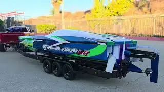 RC BOAT SPARTAN SR ON A TRAILER. 