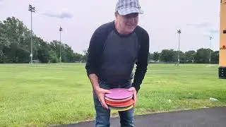 Disc Golf 16 New (Used) Discs Throwing in a Field by Ivan Katz