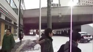 Outside the hotel , which is near Sapporo Station