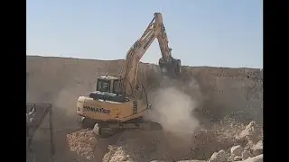 Excavator | komatsu| Excavator with Bucket lift is digging earth at construction site 